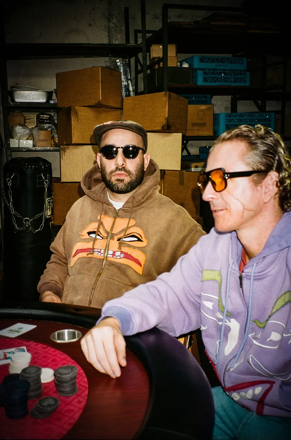 Clayface and Joker face hoodies at the poker table