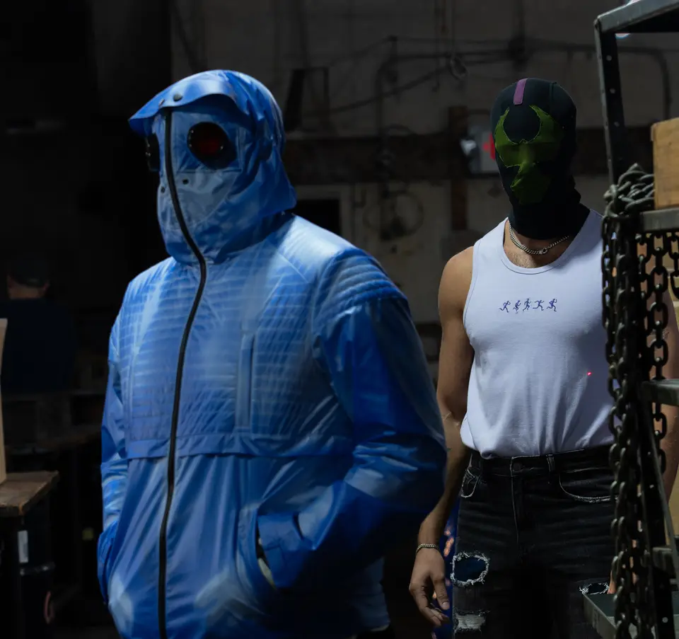 Mr. Freeze in the blue puffer beside the Bane mask