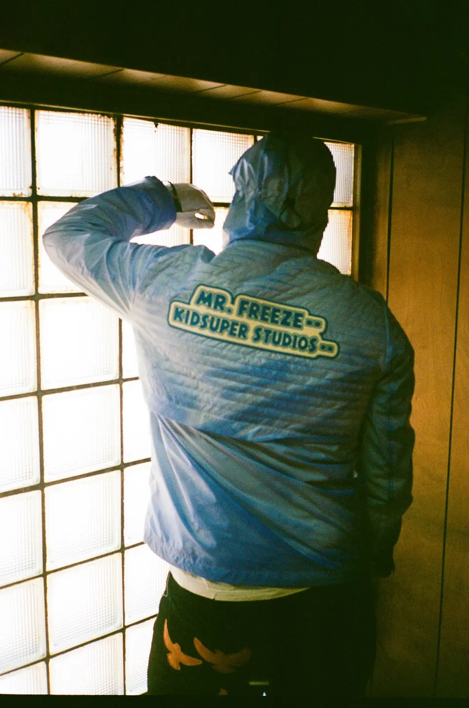 Mr. Freeze KidSuper Studios back print against a bright window