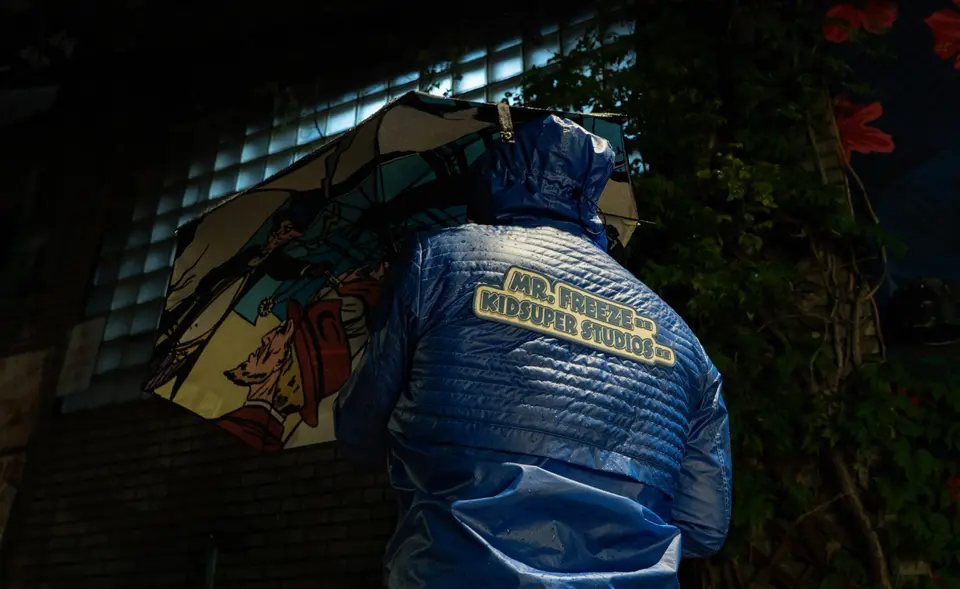 Back of the Mr. Freeze KidSuper Studios puffer jacket at night