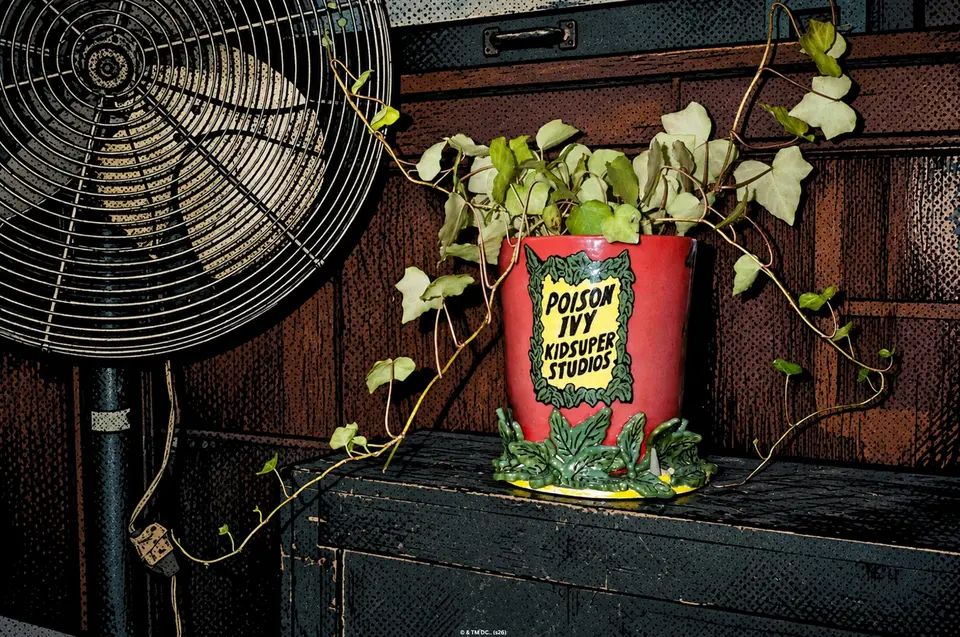 Red Poison Ivy x KidSuper Studios planter overflowing with ivy beside a fan